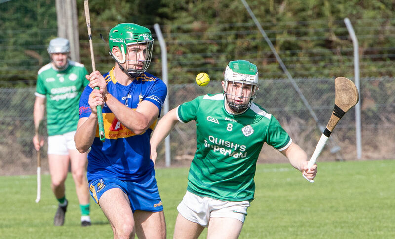 Carrigaline's Darragh King clears the ball away from Ballincollig's Mark Oldham last year. Picture: Howard Crowdy