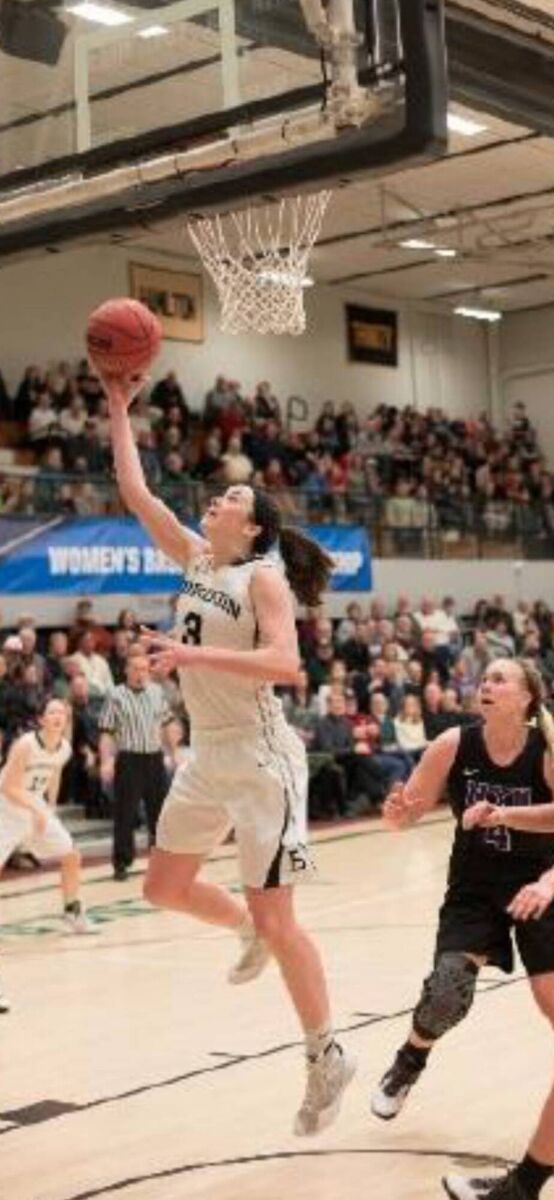 Basketball player Shannon Brady in action for Bowdoin College that is based in Brunswick Maine in a New England Small College Athletic Conference.