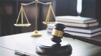 Scales of justice and Gavel on wooden table and Lawyer or Judge working with agreement in Courtroom, Justice and Law concept