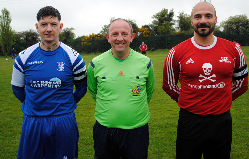 Grattan United B captain Damien McSweeney (left), with UCC B's Walter Messina, accompanied by referee Paul Bowdren.