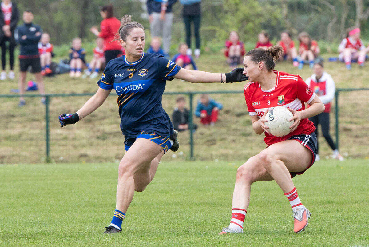 Cork's Amy McDonagh holds onto possession ahead of Tipperary's Sinead Cahill during their Munster LGFA Senior B Championship match \at Carrigaline. Picture: Howard Crowdy