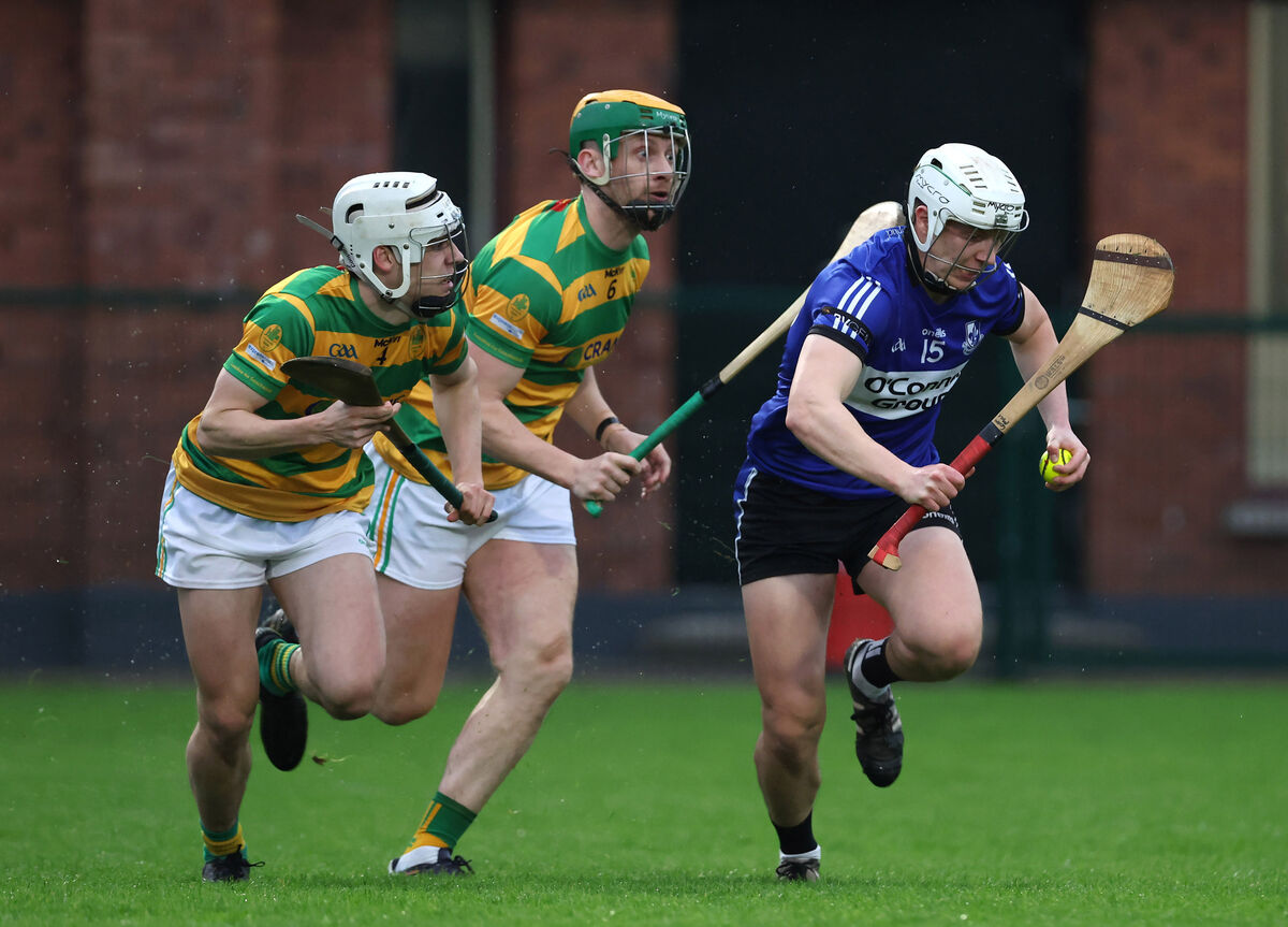  Colm McCarthy, Sarsfields, James Ryan and Alan O'Callaghan, Blackrock. Picture: Jim Coughlan.