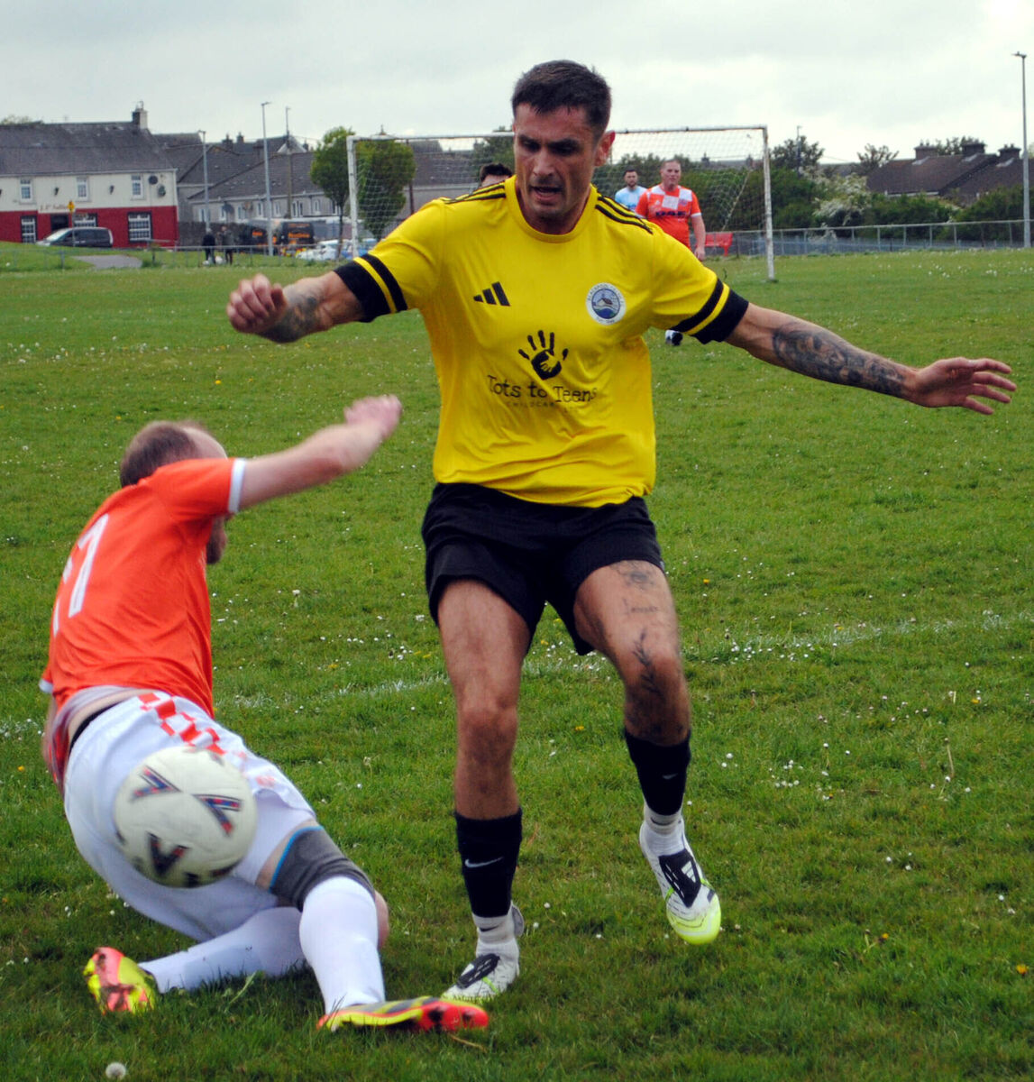 Cathedral Celtic's Ivan Skillington and Blackpool Celtic's Jamie Morrissey clash for possession at the Fairfield.