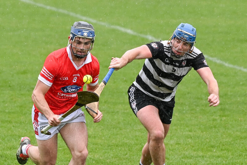 Charleville's Sean Bresnan tries to get away from Midleton's Killian McDermott. Picture: David Keane.