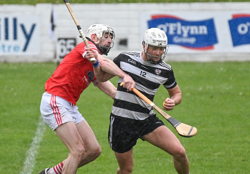 Midleton's David Cremin is tackled by Charleville's Jack Buckley. Picture: David Keane.