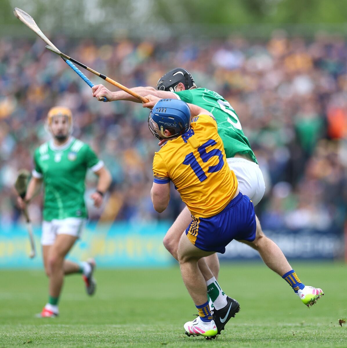 Clare’s Shane O'Donnell takes a knock from Diarmaid Byrnes of Limerick. Picture: INPHO/James Crombie