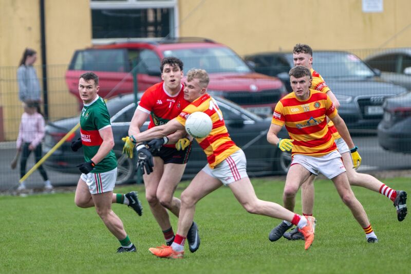 Newcestown's Richard O’Sullivan puts Clonakilty goalkeeper Mark White under pressure. Picture: Chani Anderson