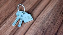 Close-up of house keys on a wooden table