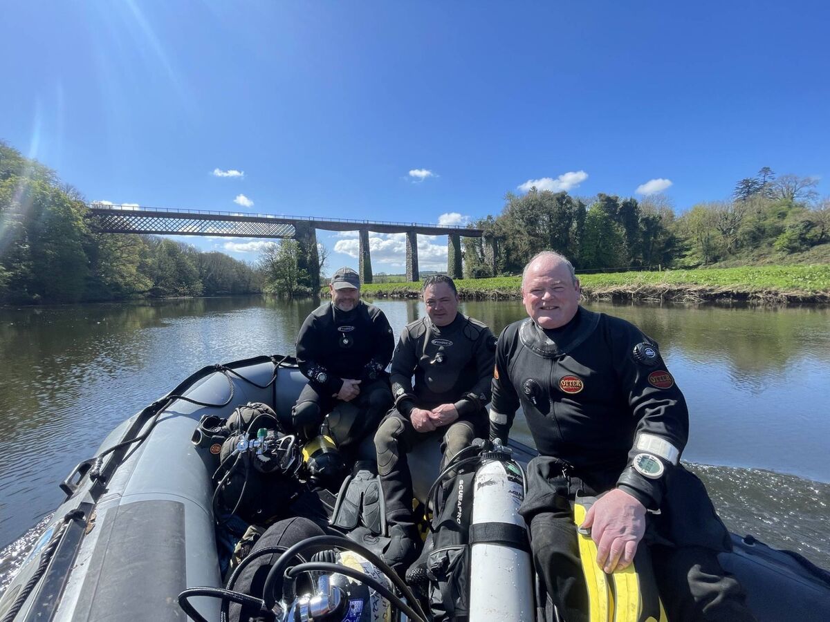 Blackwater Sub Aqua Search and Recovery Unit volunteers Graham Burke, Des Browne, and Mike Reidy the water in Fermoy, with the Viaduct behind them. Picture: Kenneth Barry