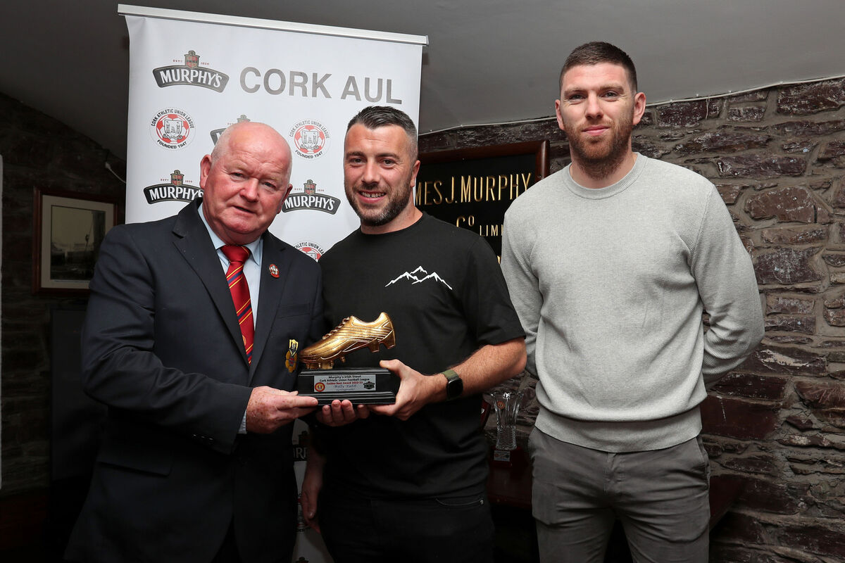 Denis Crowley, Cork AUL, presents the 2023 Golden Boot Award to Billy Tabb, Grangevale. Also included is Luke Connolly, Heineken Ireland. Picture: Jim Coughlan.