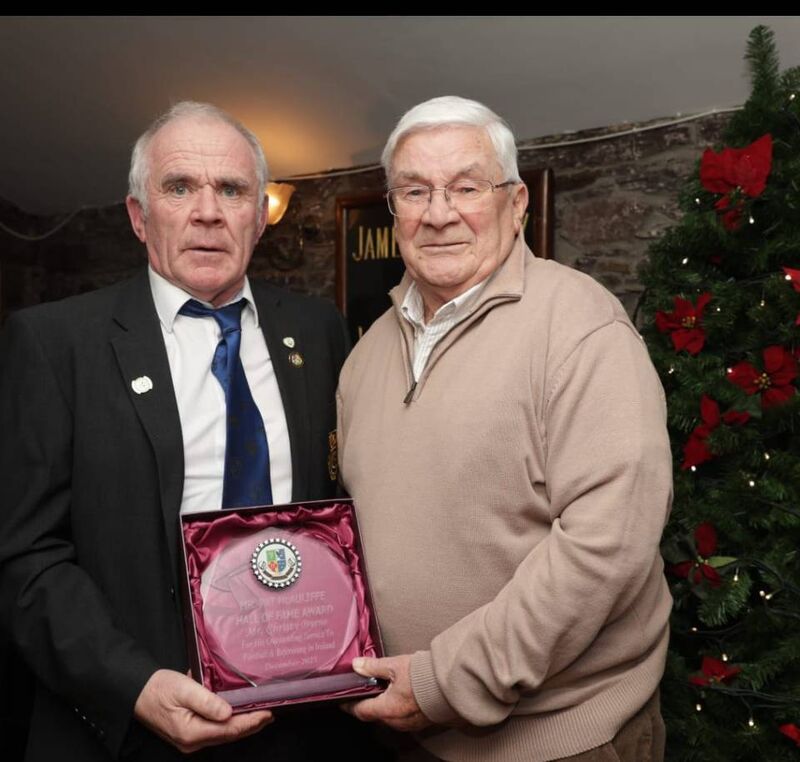 Christy Byrne receiving the Pat McAuliffe Hall of Fame Award from Pat Buckley in the Kiln at Heineken Brewery. 
