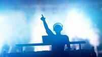 Club, disco DJ playing and mixing music for people. Nightlife