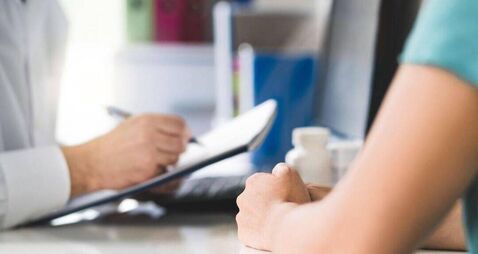 Sick patient visiting doctor in health care center or emergency room. Woman in appointment and meeting with physician or nurse.