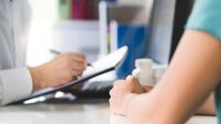 Sick patient visiting doctor in health care center or emergency room. Woman in appointment and meeting with physician or nurse.