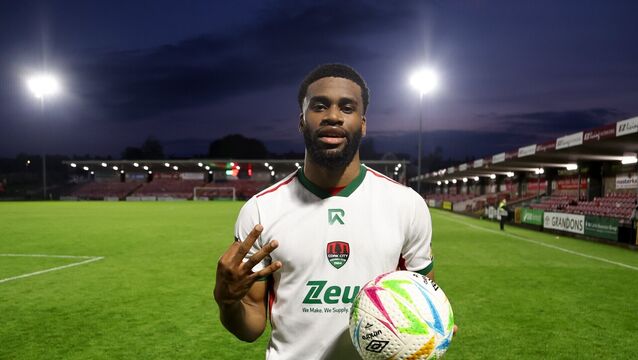 <p>CLINICAL: Hans Mpongo of Cork City celebrates with the match ball after scoring a hat-trick against UCD. Picture: Michael P Ryan/Sportsfile</p>