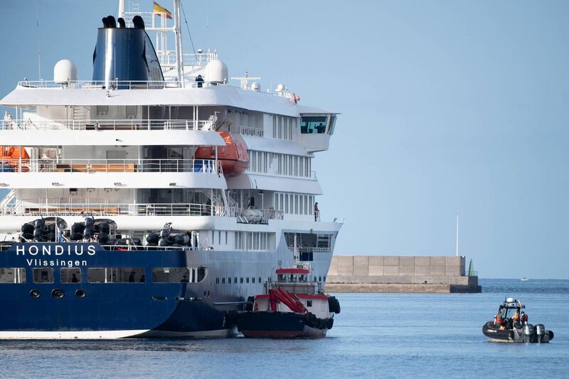 Boats approach the Dutch flagged hantavirus-stricken cruise ship MV Hondius after it arrived at the port. Photo: Jorge Guerrero via Getty Images