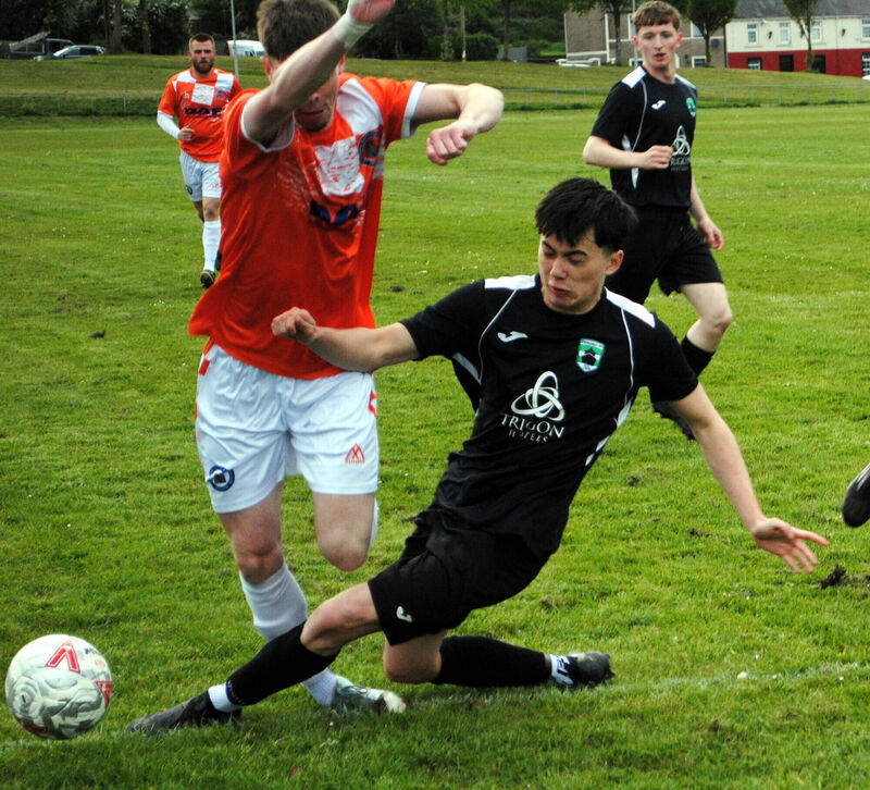 Springfield's Alan Kelly gets in a tackle on Cathedral Celtic's Scott O'Callaghan in the action at the Fairfield. Picture: Barry Peelo. Springfield's Alan Kelly gets in a tackle on Cathedral Celtic's Scott O'Callaghan in the action at the Fairfield. Picture: Barry Peelo.