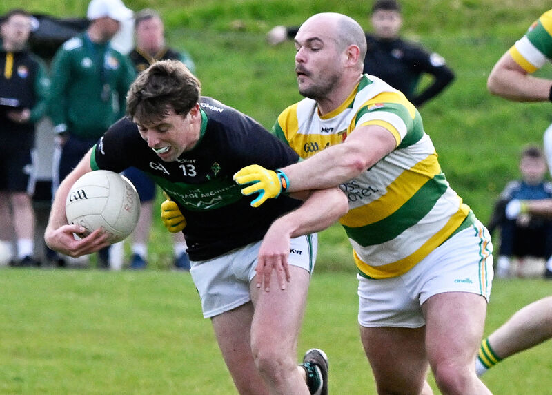 Nemo Rangers' Ross Corkery is tackled by Thomas O'Rourke of Carbery Rangers. Picture: Martin Walsh