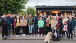 <p>A group of people on the Darkness To Light walk on Saturday outside Coffee Brothers at The Mardyke in Cork city, owned by Adrian and Sean J. Twomey, brother of the late Mark Twomey. Aoibhinn Twomey is at the front with her golden retriever Sophie.</p>