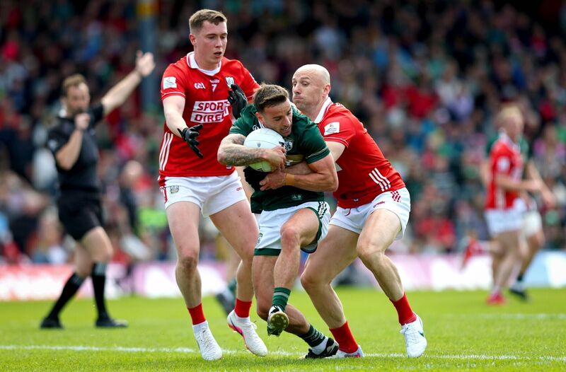 Kerry’s Micheál Burns with Brian O'Driscoll and Luke Fahy of Cork. Picture: INPHO/Ryan Byrne