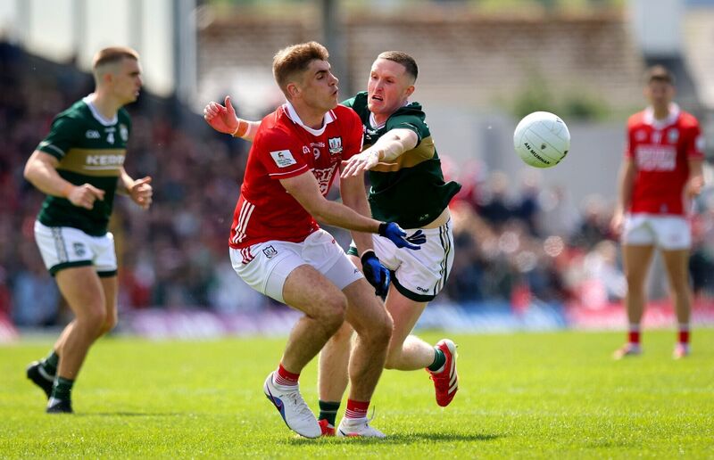 Kerry’s Jason Foley and lan Maguire of Cork battle for the ball. Picture: INPHO/Ryan Byrne Kerry’s Jason Foley and lan Maguire of Cork battle for the ball. Picture: INPHO/Ryan Byrne