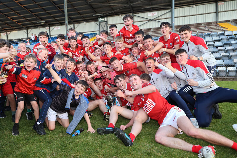 Cork players celebrate after winning the Munster MFC in 2022. Picture: INPHO/Bryan Keane