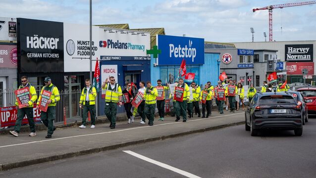 <p>Siptu ambulance workers picket at the Kinsale Road roundabout in Cork yesterday as part of a nationwide paramedic strike. Picture: Chani Anderson.</p>