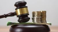 Gavel with Euro Banknotes and Coins – Symbols of Financial and Legal Matters