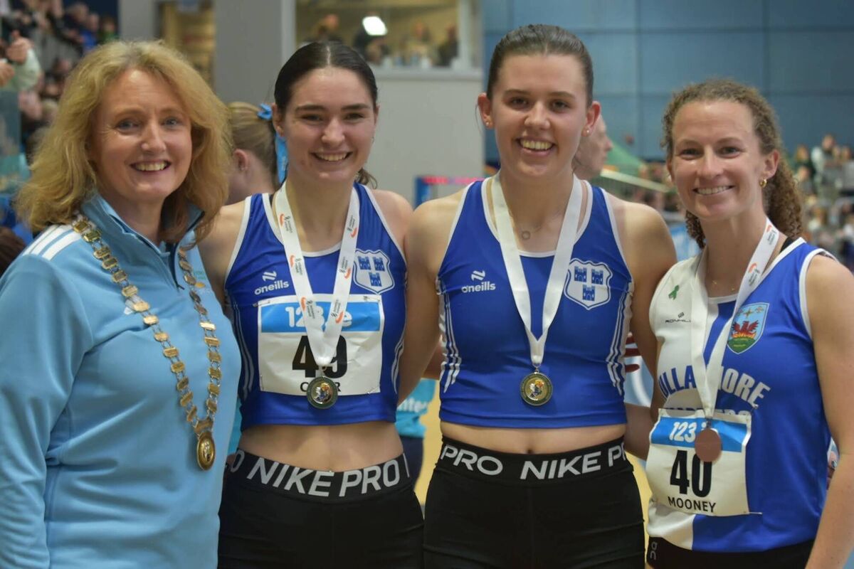 Lucy Holmes (middle) after winning her first National Senior Indoor 1500m title.