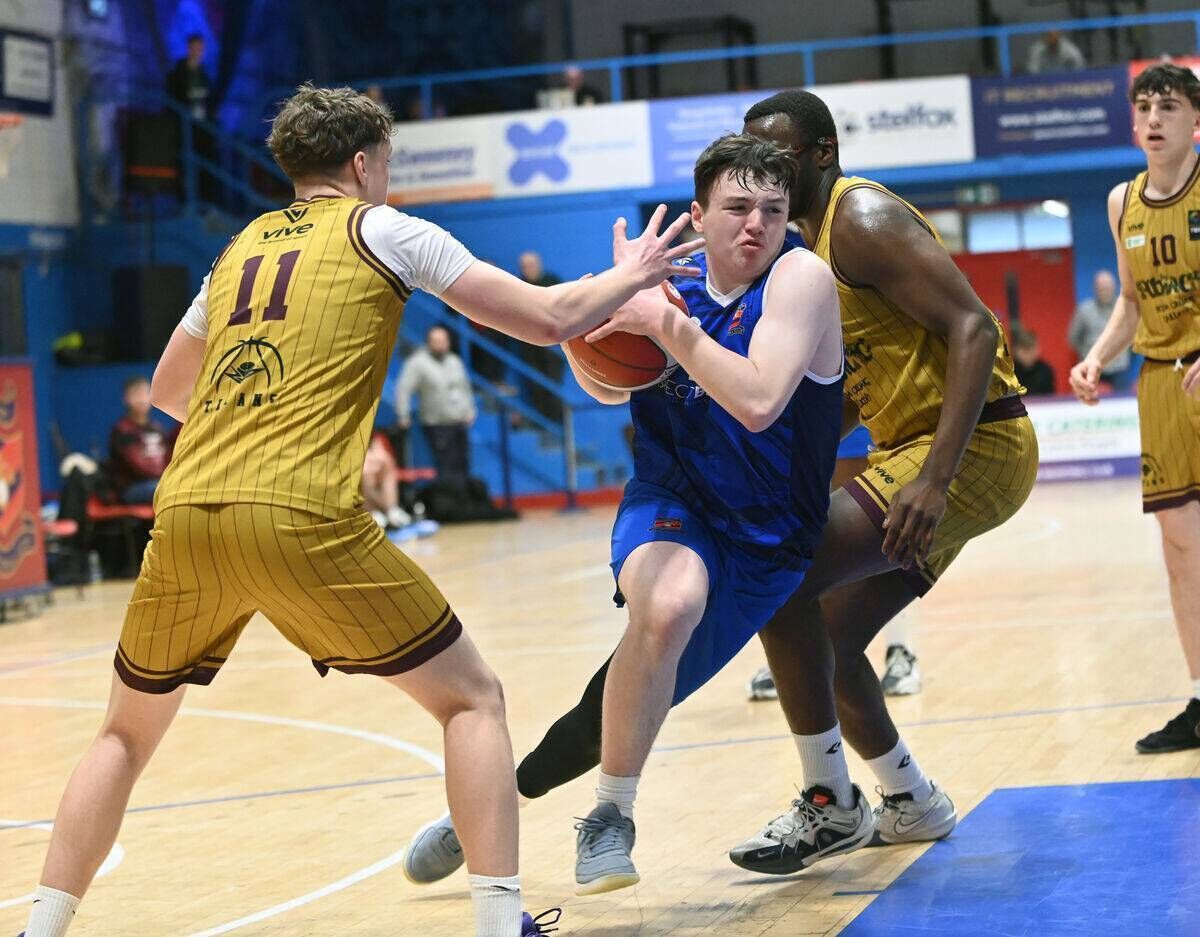 Neptune's Sean Noonan breaks between Titans' Alban Hart and Nathan Gbingie. Picture: Eddie O'Hare