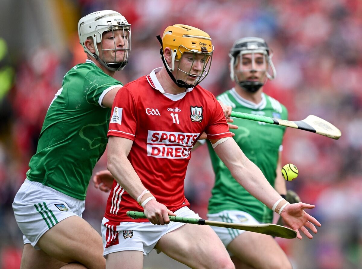 Shane Barrett of Cork is tackled by Kyle Hayes of Limerick. Picture: Ray McManus/Sportsfile