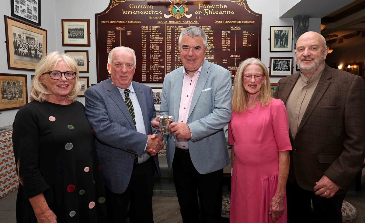 The family of Cork player, Dr Jim Young, presenting his miniature Liam MacCarthy cup to Glen Rovers, during the commemorative event to celebrate the life of the late Dr. Jim Young, at the Glen Rovers clubhouse, Ballincollie Road, Cork. Pictured are: Bernadette, Paul and Miriam Young, presenting their late father's miniature Liam MacCarthy cup to Liam Martin, Chairperson Glen Rovers (centre). Also included is Diarmuid O'Donovan, event presenter &amp; Chairperson Glen Rovers &amp; St. Nicks Underage.Picture: Jim Coughlan.