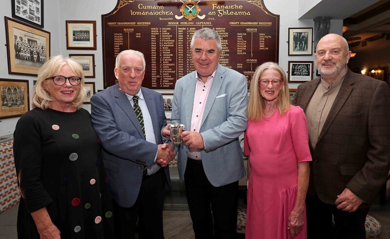 The family of Cork player, Dr Jim Young, presenting his miniature Liam MacCarthy cup to Glen Rovers, during the commemorative event to celebrate the life of the late Dr. Jim Young, at the Glen Rovers clubhouse, Ballincollie Road, Cork. Pictured are: Bernadette, Paul and Miriam Young, presenting their late father's miniature Liam MacCarthy cup to Liam Martin, Chairperson Glen Rovers (centre). Also included is Diarmuid O'Donovan, event presenter &amp; Chairperson Glen Rovers &amp; St. Nicks Underage.Picture: Jim Coughlan.