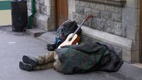 Traveller asleep on the platform