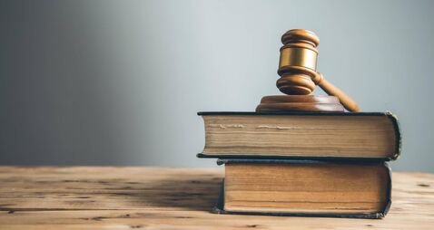 wooden judge on book on the desk