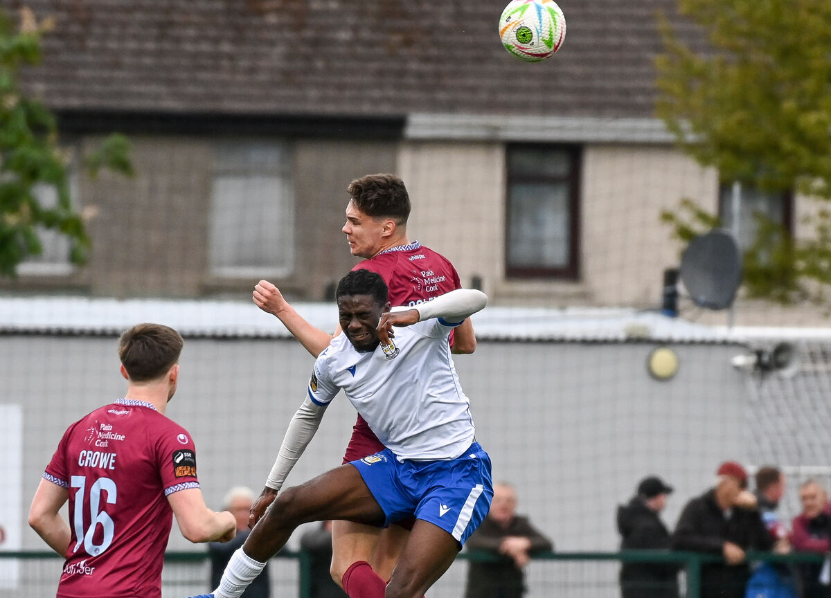  Cobh Ramblers' Cian Coleman battles in the air with Athlone Town's Gradi Lomboto. Picture: David Keane.