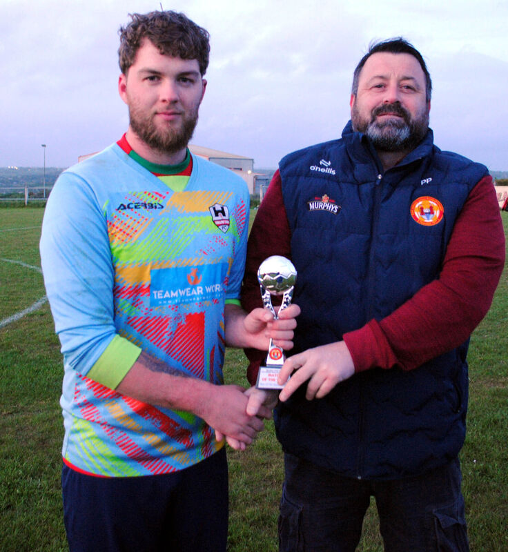 Paul Pepper (Cork AUL) presents the Man of the Match award (Sponsored by Gary McCarthy Trophies) to Mallow Town's Artur Osinski. Picture: Barry Peelo.