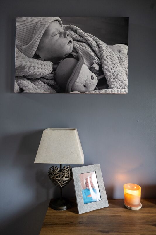 The hallway of Amy and Jason Barry’s home in Cobh features a large portrait of their son Connie. Picture: Chani Anderson.