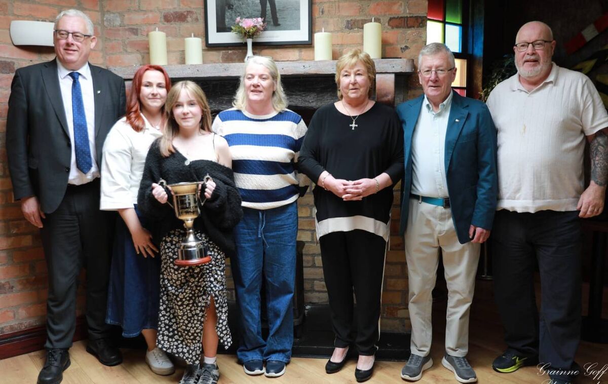 L To R: Tommy Gould, Fiona Aston, Amellia Aston, Irene Morrissey, Vicky Aston, Dan O'Connell, and John Morrissey, pictured with the Victor Aston Cup presented to the Golden Gloves Boxing Club as the best club in cork for the 2025/ 2026 season. 