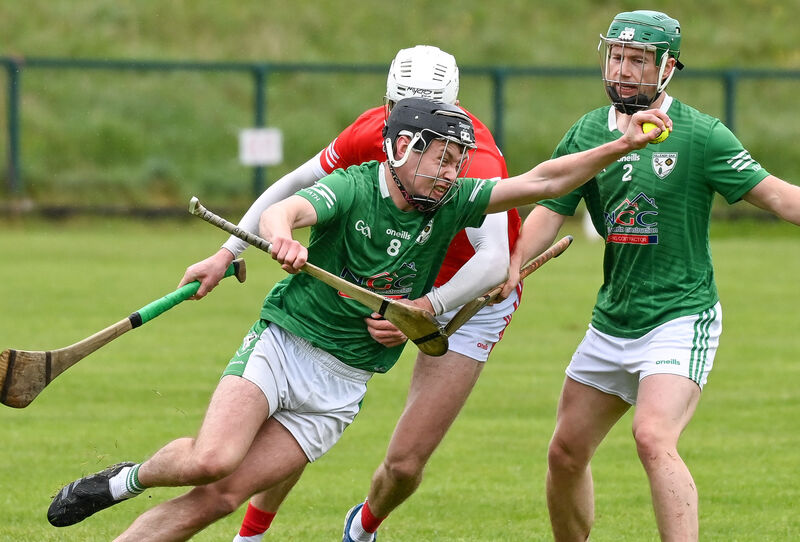  Killeagh's Evan Lane tries to get away from Charleville's Tim Hawe at Charleville. Picture: David Keane