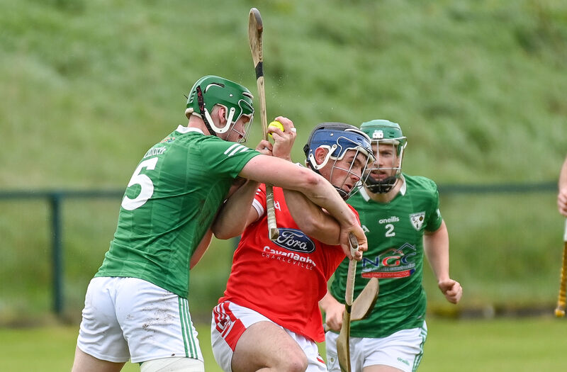  Charleville's Cathal O'Carroll is tackled by Killeagh's Rob Sinclair at Charleville. Picture: David Keane
