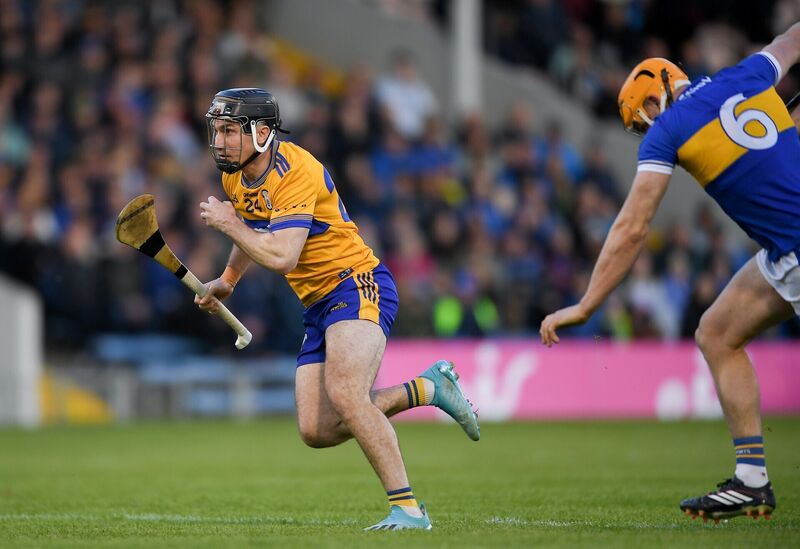 Clare's Ian Galvin on his way to score his goal despite the efforts of Ronan Maher of Tipperary. Picture: John Sheridan/Sportsfile