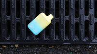 Discarded e-cigarette on drain cover