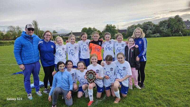 The Wilton U12 team that won the CWSSL U12 Premier Division title with their coaches. 