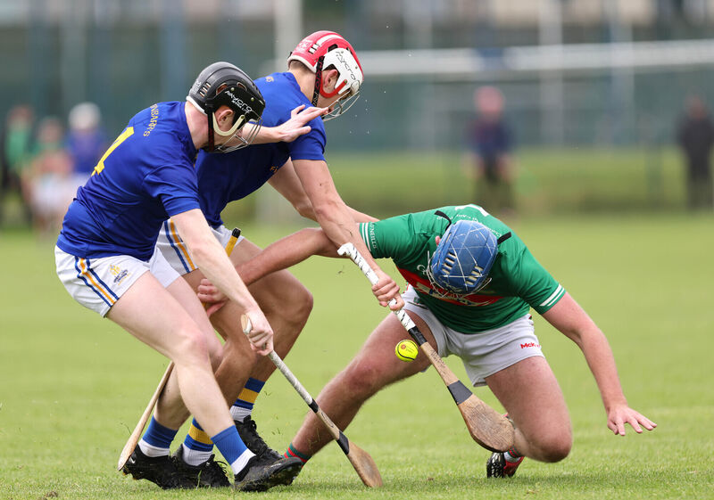  Cian Walsh and Aidan Barry, St Finbarr's, battle Mark O'Neill, Fr O'Neill's. Picture: Jim Coughlan.