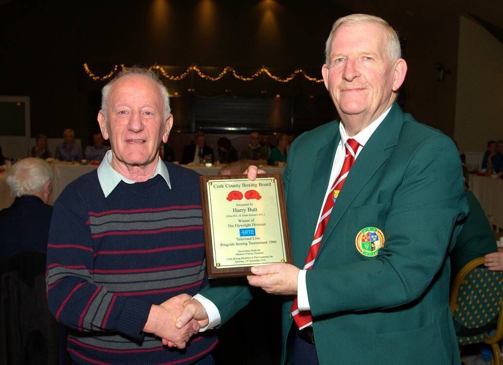 1966 winner of the RTE Ringside Boxing Tournament, Harry Butt, receiving an award to mark that occasion from Cork County Boxing Board President Mr Michael O'Brien. Picture: Doug Minihane.