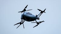 A Manna delivery drone flies over the ground during the match 3/5/2026