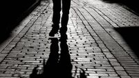 iStock-182773084.jpg Black And White Shadow Of Man Walking On Sidewalk