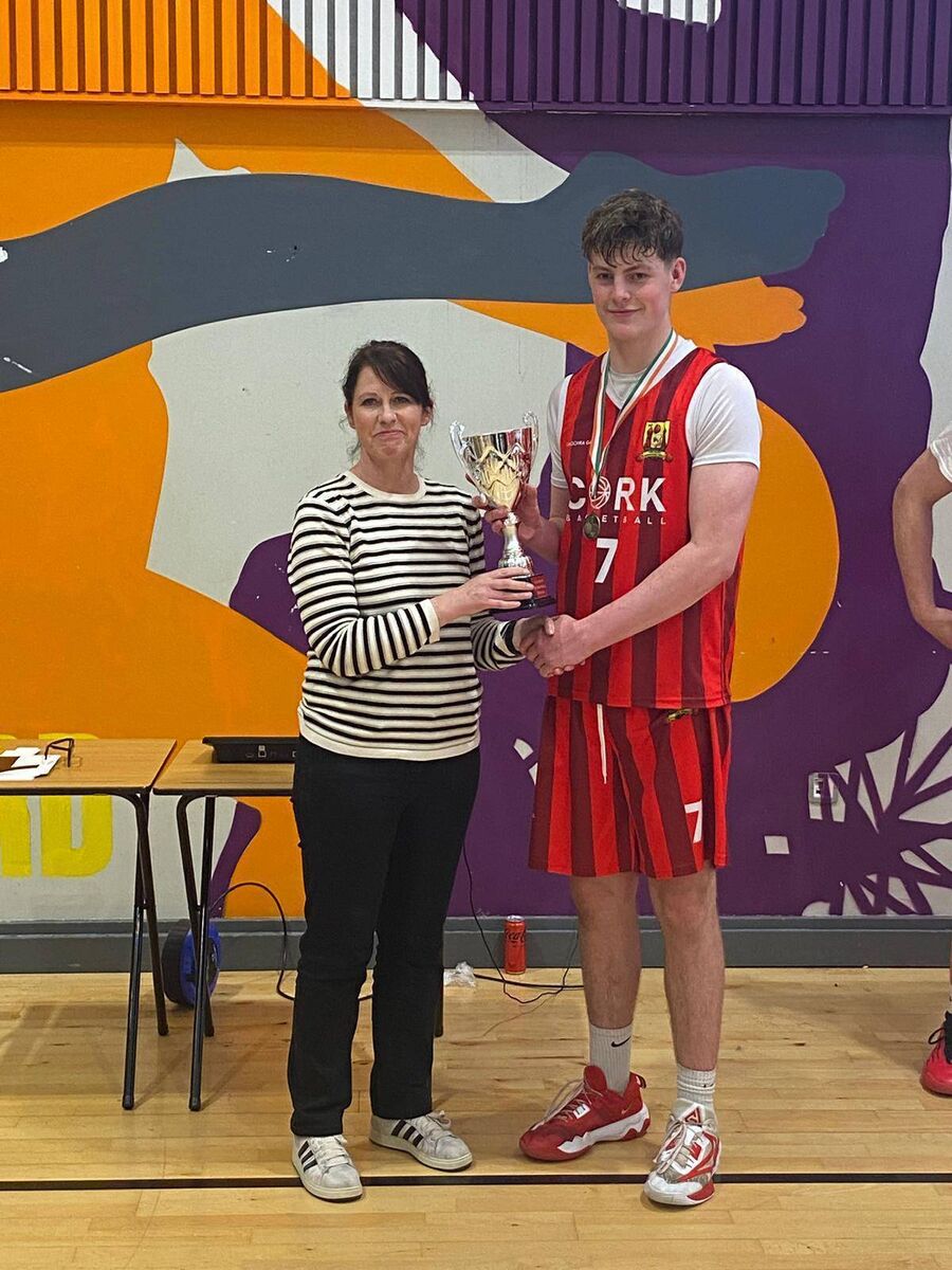 Cork U17 captain Conor Carroll receiving the All-Ireland Cup following their win over Dublin. JC