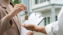 lease, rental and selling home. Real estate agent manager smile holding key for new owner. rent house, Sales, loan credit financ